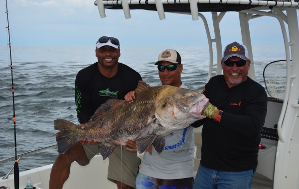 Henry waszczuk of “Fishing The Flats” and Donovan Darius of the Jacksonville Jaguars with a monster Drum