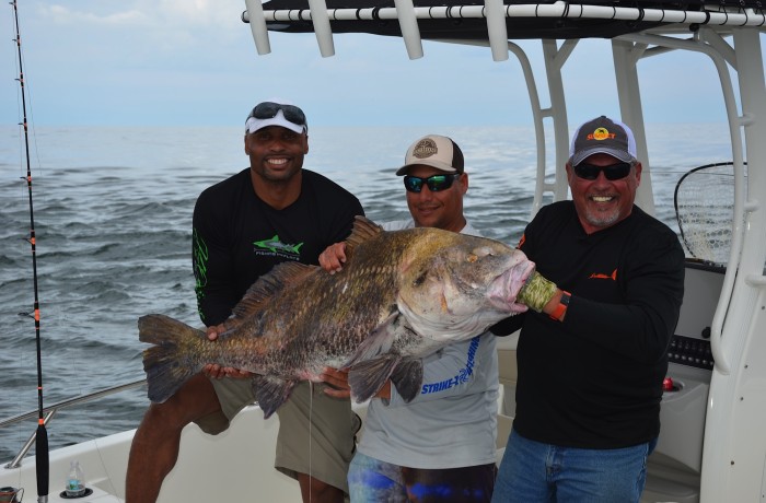 Henry waszczuk of “Fishing The Flats” and Donovan Darius of the Jacksonville Jaguars with a monster Drum
