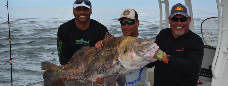 Henry waszczuk of “Fishing The Flats” and Donovan Darius of the Jacksonville Jaguars with a monster Drum