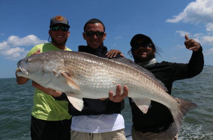 Wess Reeder, Steve Sanchez and Monster Mike with the victory shot