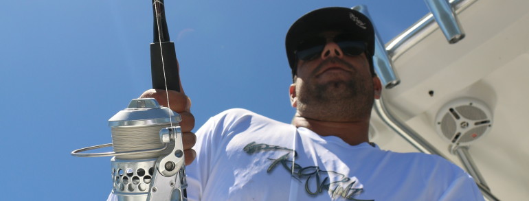 Chris of Reel Skins Fishing Apparel doing work with the Accurate Twin Spin
