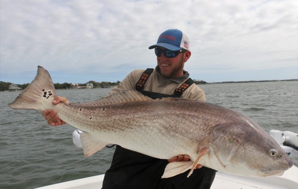 Wess Reeder with a beast of a Bull Red