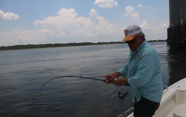 Bill Dance tussling with a River Monster