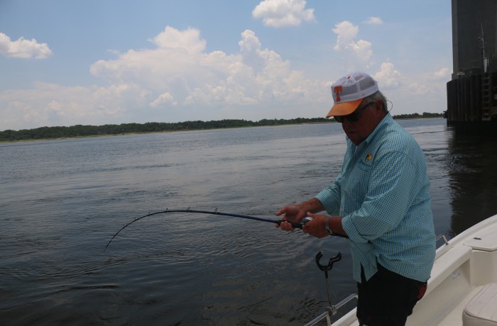 Bill Dance tussling with a River Monster