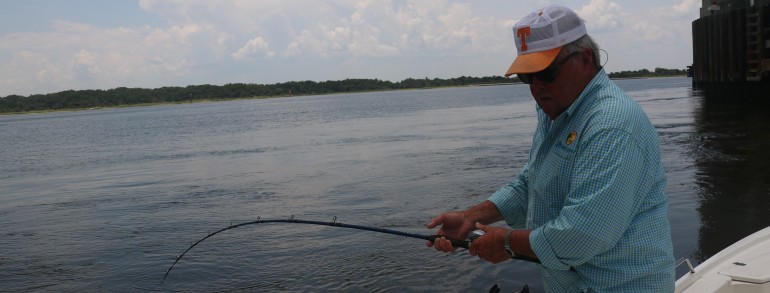 Bill Dance tussling with a River Monster