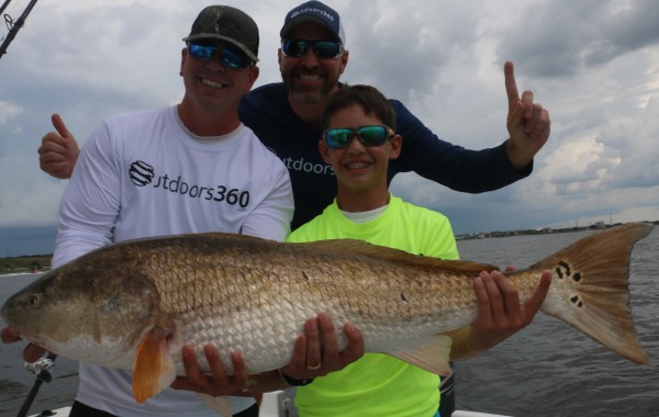 Rob Chapman of Outdoors 360 and crew with a River Monster
