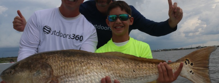 Rob Chapman of Outdoors 360 and crew with a River Monster
