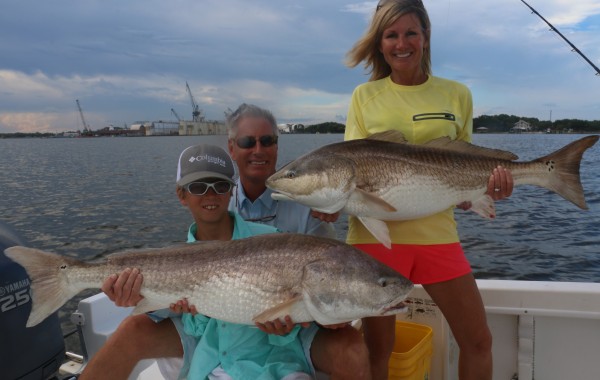 Another happy family posing with the spoils of war