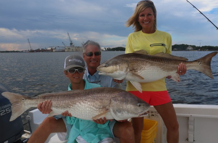Another happy family posing with the spoils of war