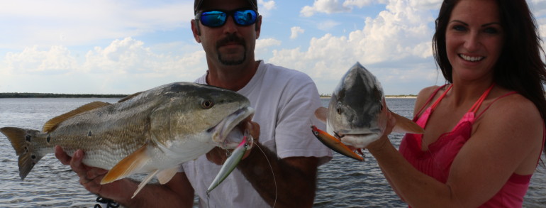 Jonathan and Sabrina Clark with a set of twins caught on Rapala XRaps