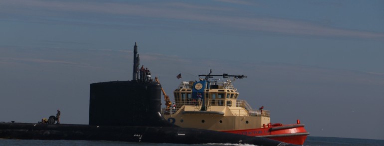 Navy submarine coming through Mayport Inlet